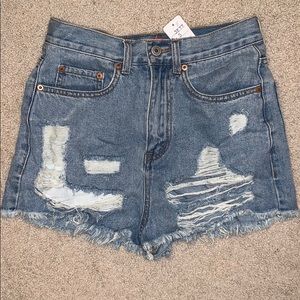 Distressed high waisted denim shorts.
